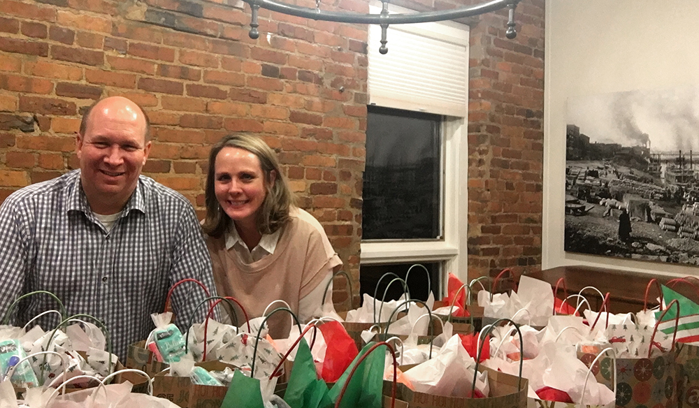 John and Rebecca deliver Christmas gift baskets to local seniors